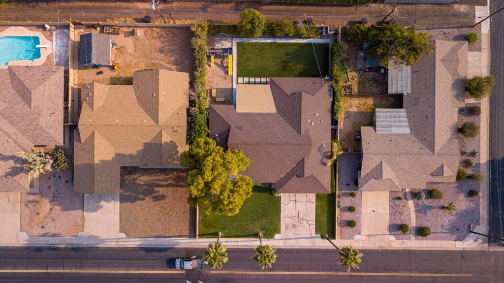 Modern Arizona home with a green artificial grass front yard boosting curb appeal and home value