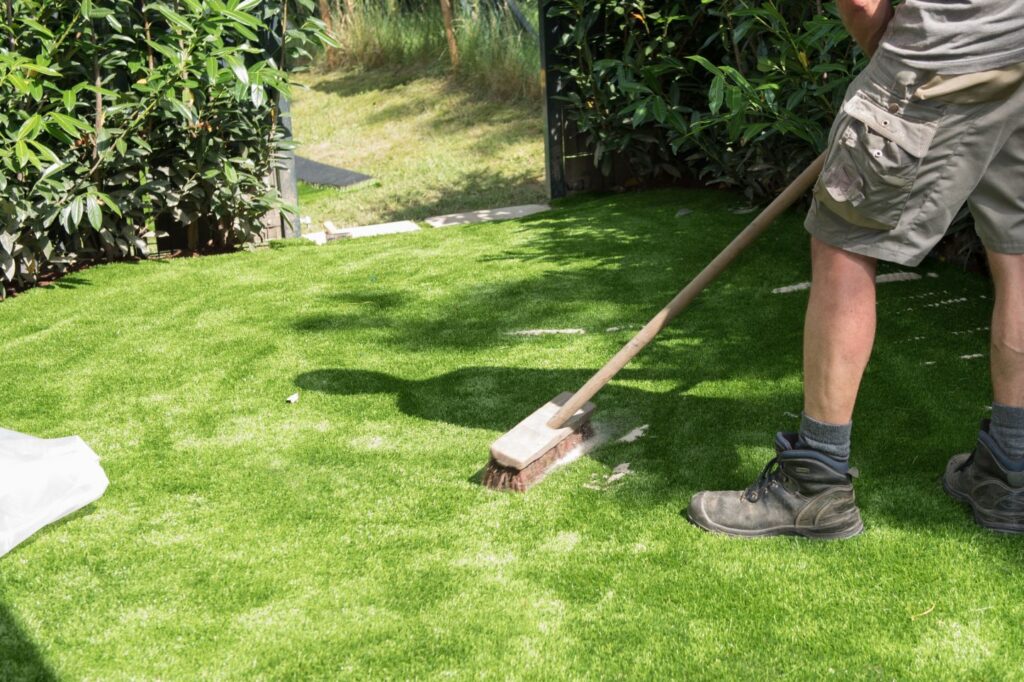 Silica sand infill brushed into artificial turf blades
