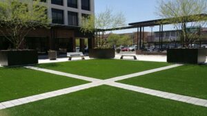 Commercial property entrance with low-maintenance artificial grass in Arizona