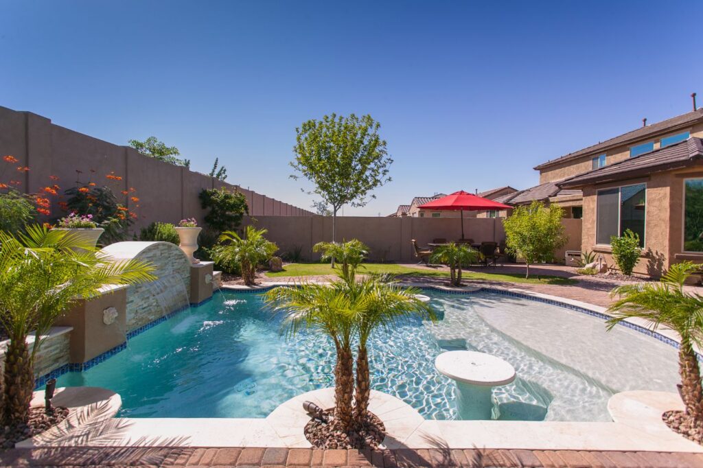Well-designed Arizona backyard hardscape with pavers and seating