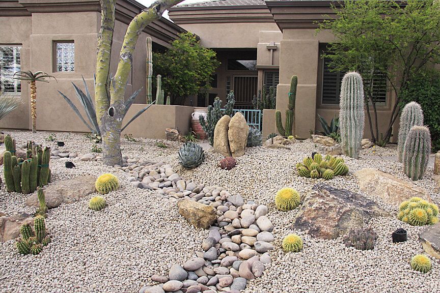 Desert yard landscaped with decorative rock and gravel in Arizona