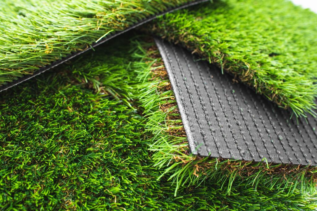 Close-up of artificial turf blade fibers showing texture and color