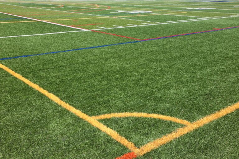 Athlete training on a synthetic turf sports field in Arizona
