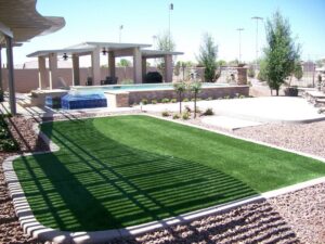 Water-conscious Arizona landscape with turf, gravel, and native plants